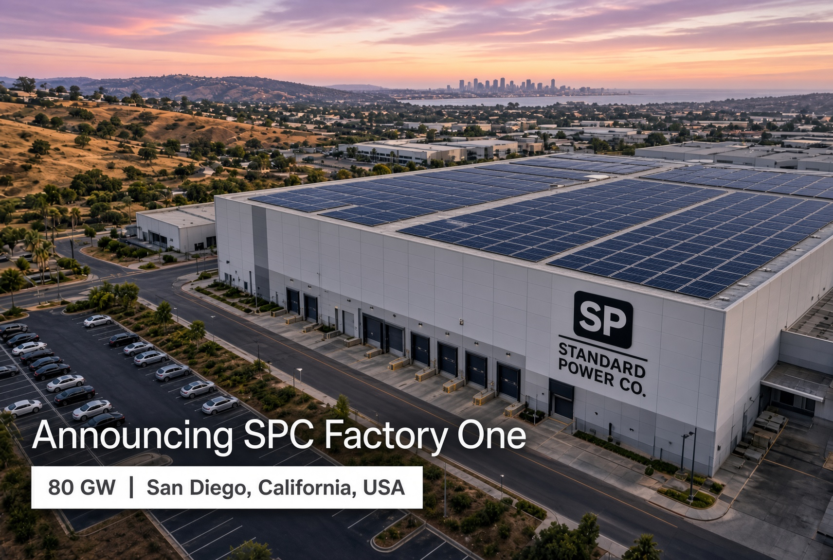 Aerial view of SPC Factory One, a solar-topped battery manufacturing facility overlooking San Diego at sunset